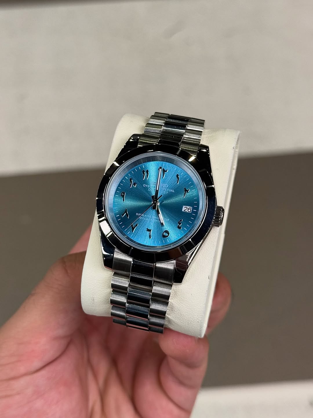 Ice Blue Arabic Dial Seiko mod watch on wrist with luxury design