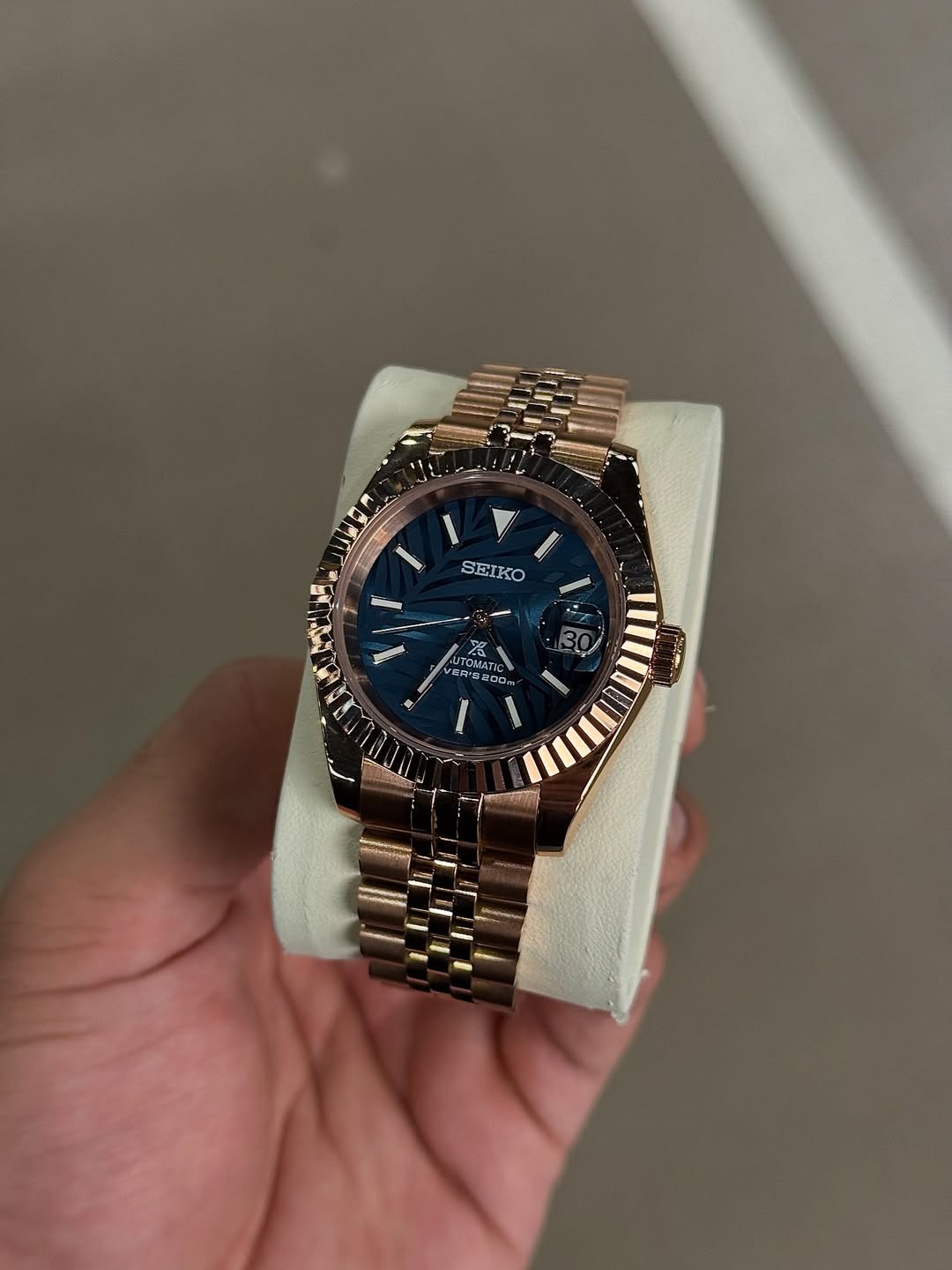 Rose Gold Dial Seiko mod watch on wrist with luxury design