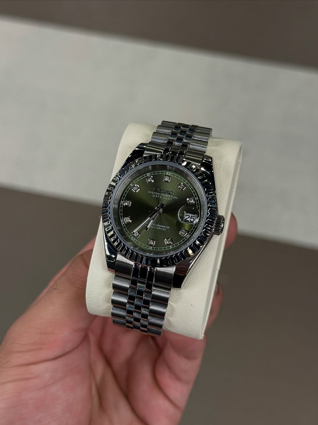 Olive Diamond Dial Seiko mod watch on wrist with luxury design