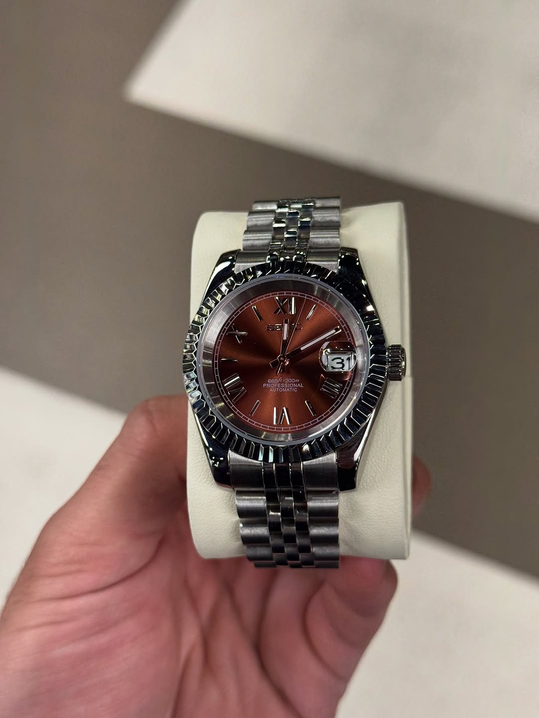 Chocolate Roman Dial Seiko mod watch on wrist with luxury design