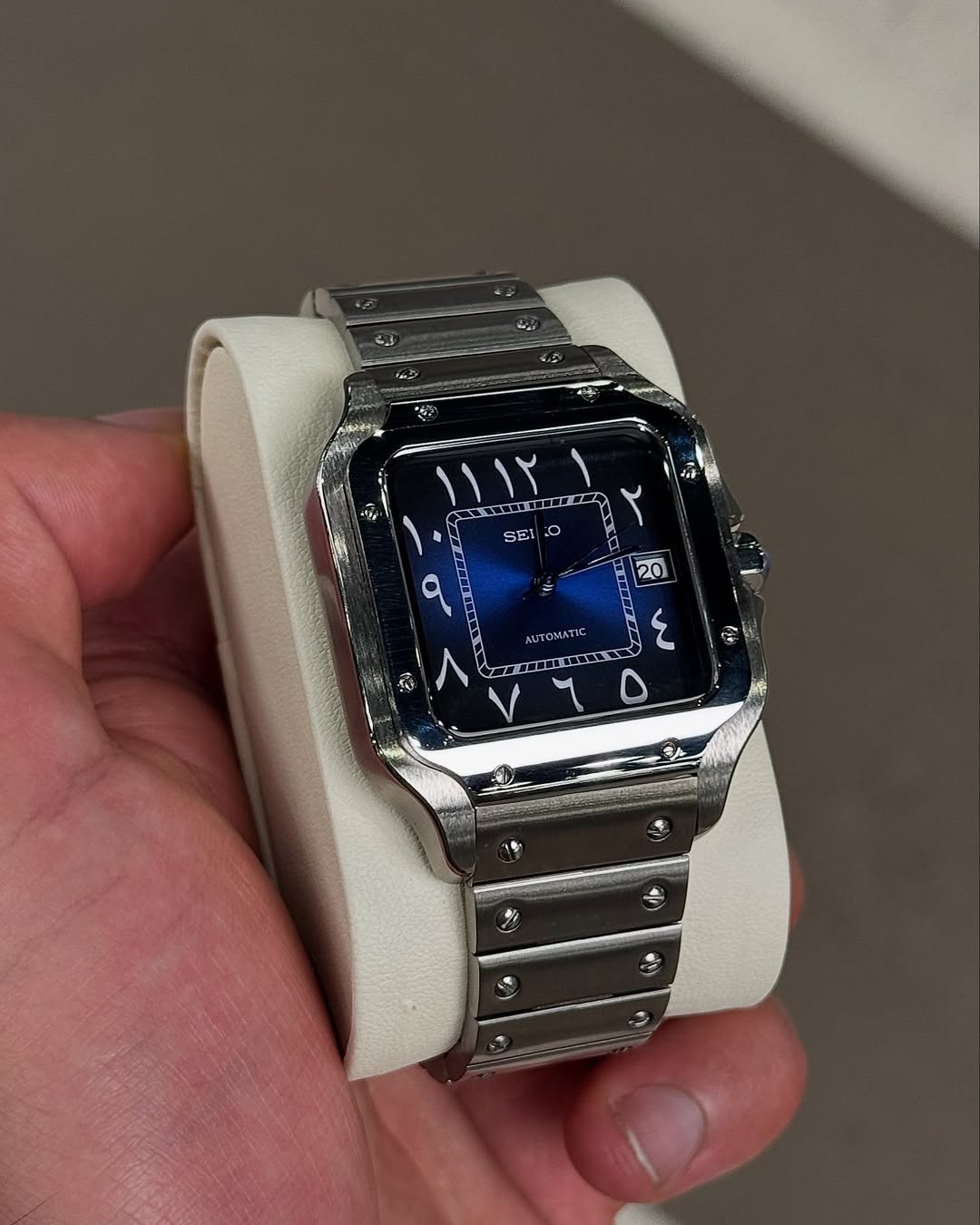 Blue Arabic Seiko mod watch on wrist with luxury design