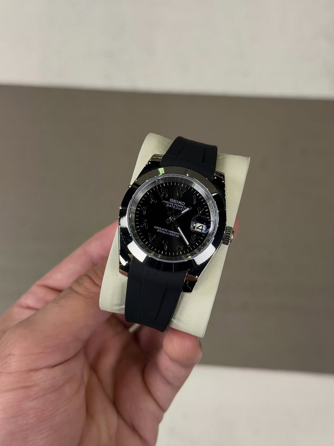 Black Arabic Dial Seiko mod watch on wrist with luxury design