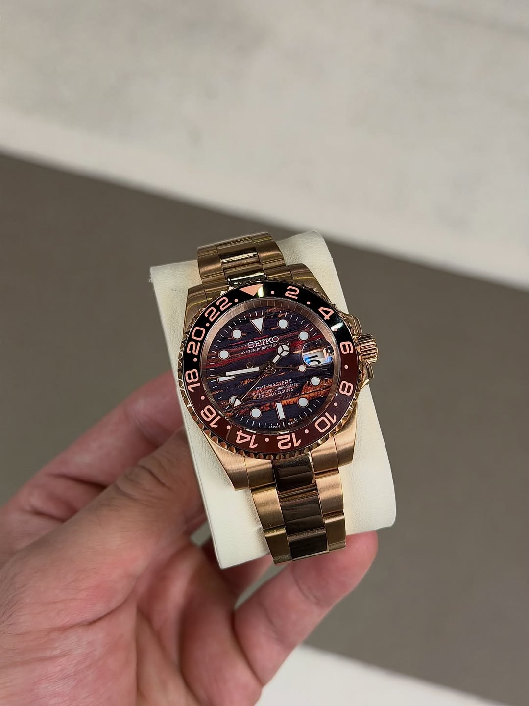 Rose Tiger Gmt Seiko mod watch close-up with case and dial details