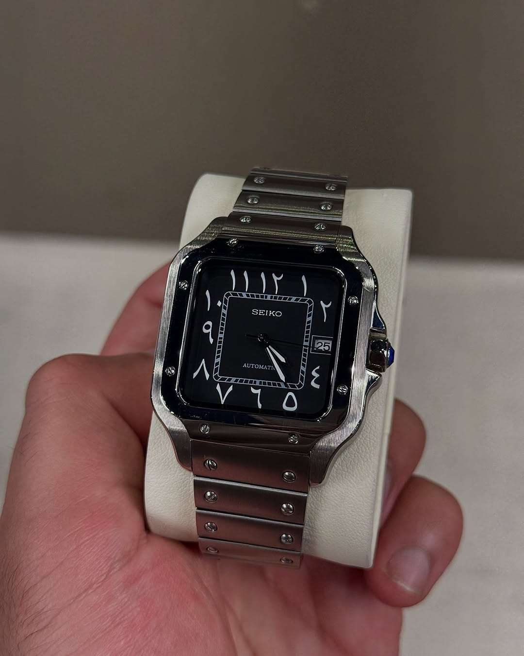 Black Arabic Seiko mod watch close-up with case and dial details