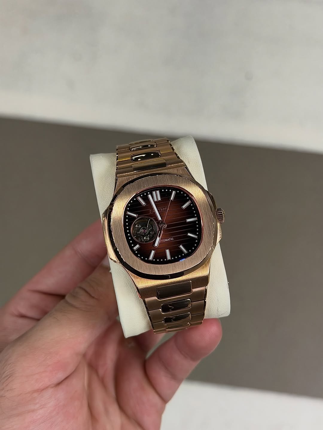 Rose Gold Open Heart Seiko mod watch on wrist with luxury design