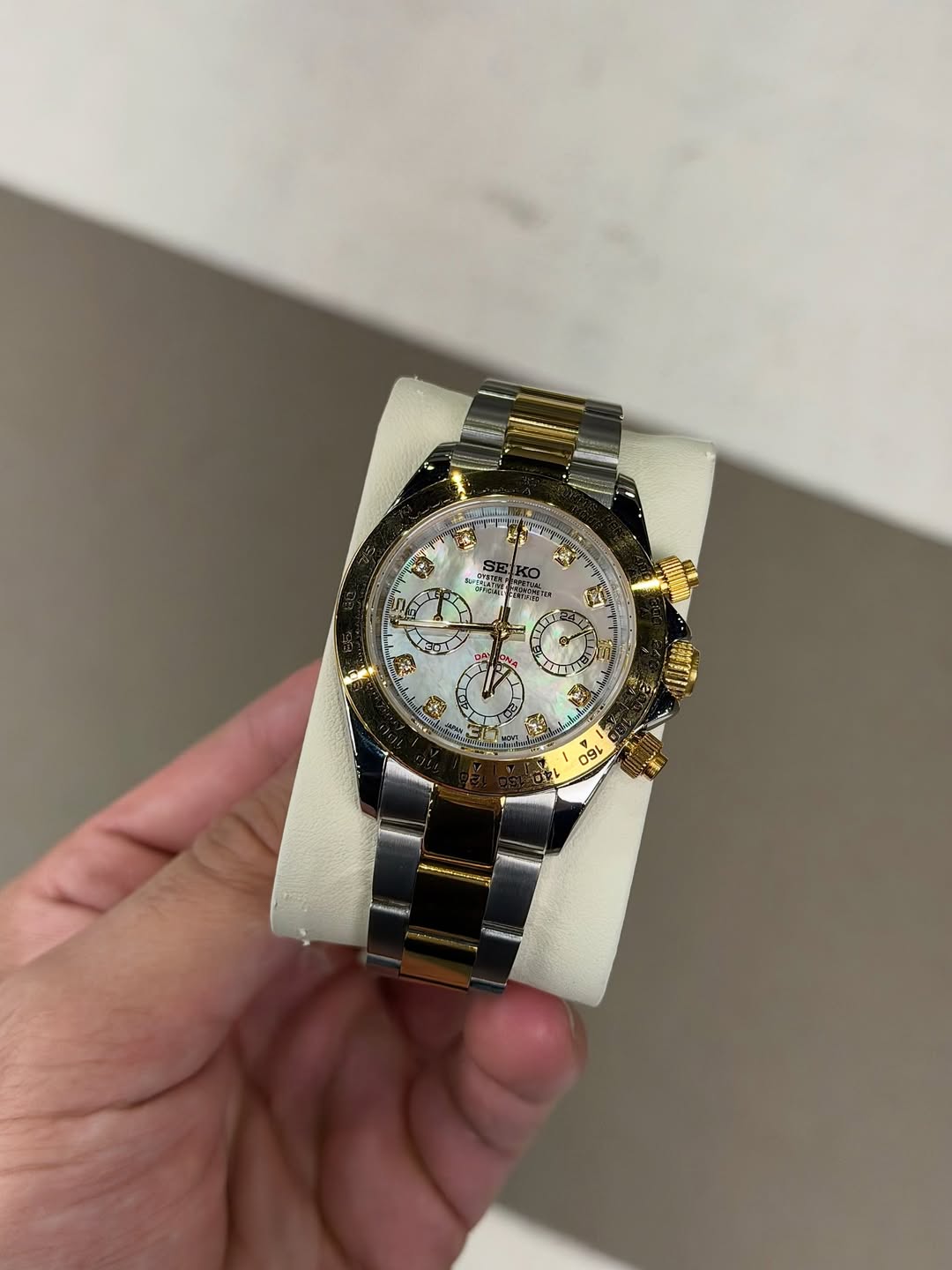 Gold White Roman Chronograph Seiko mod watch on wrist with luxury design