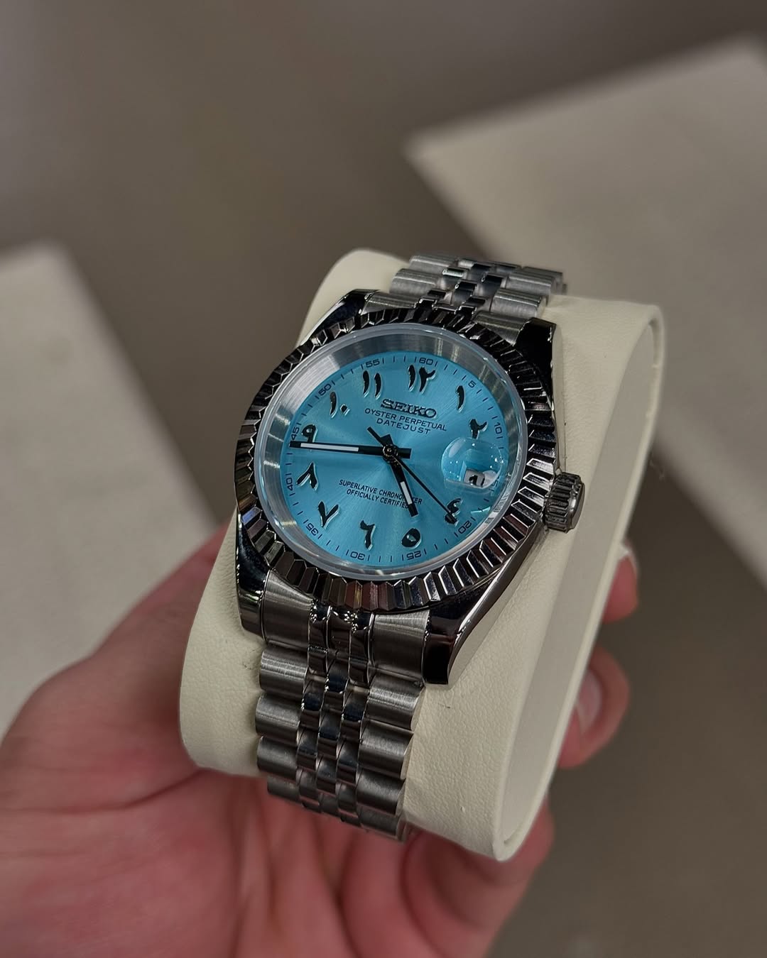 Sky Blue Arabic Dial Seiko mod watch on wrist with luxury design