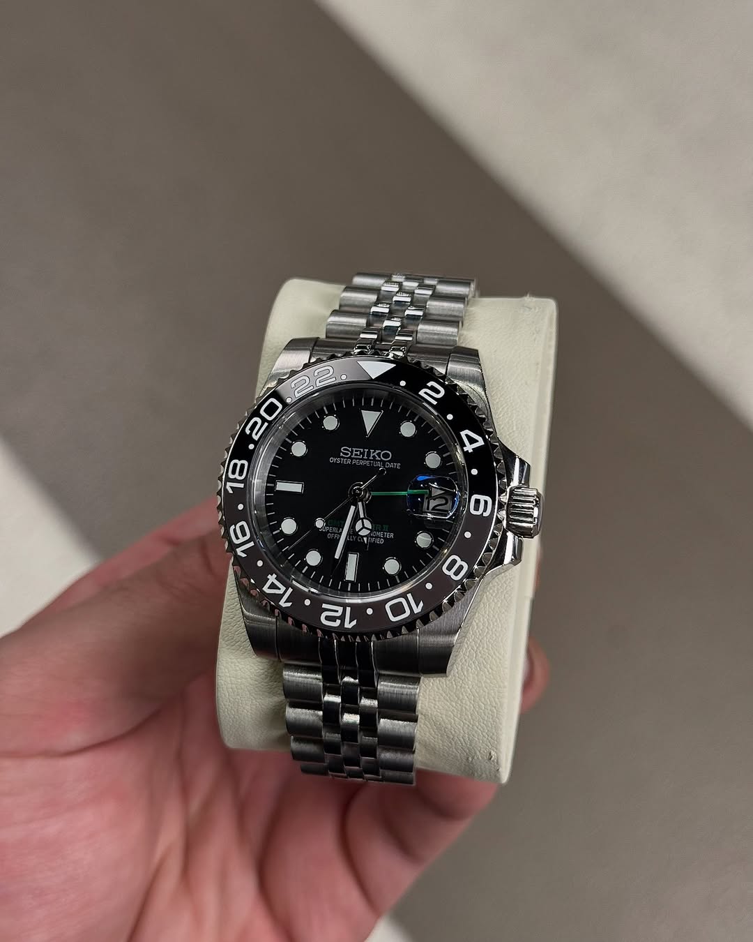 Ghost Shadow Gmt Seiko mod watch on wrist with luxury design