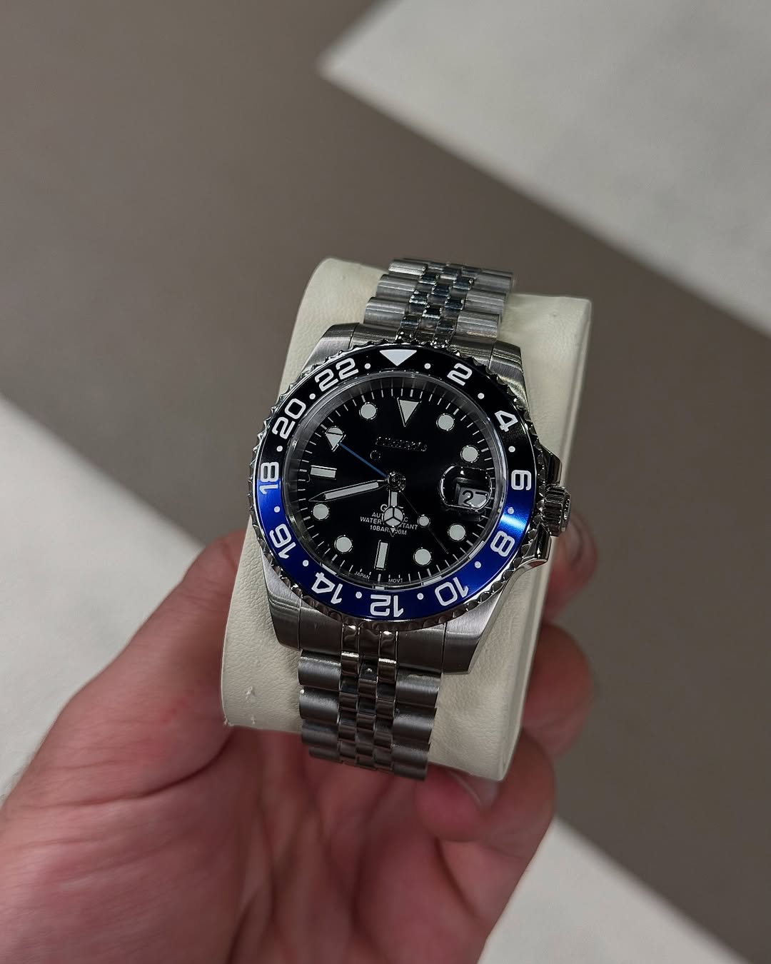 Thunder Blue Gmt Seiko mod watch on wrist with luxury design