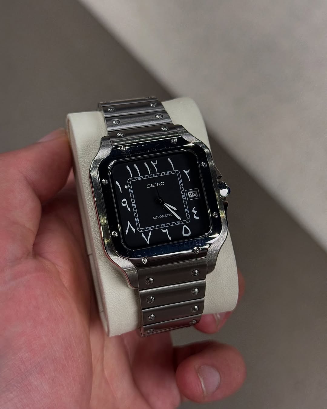 Black Arabic Seiko mod watch on wrist with luxury design