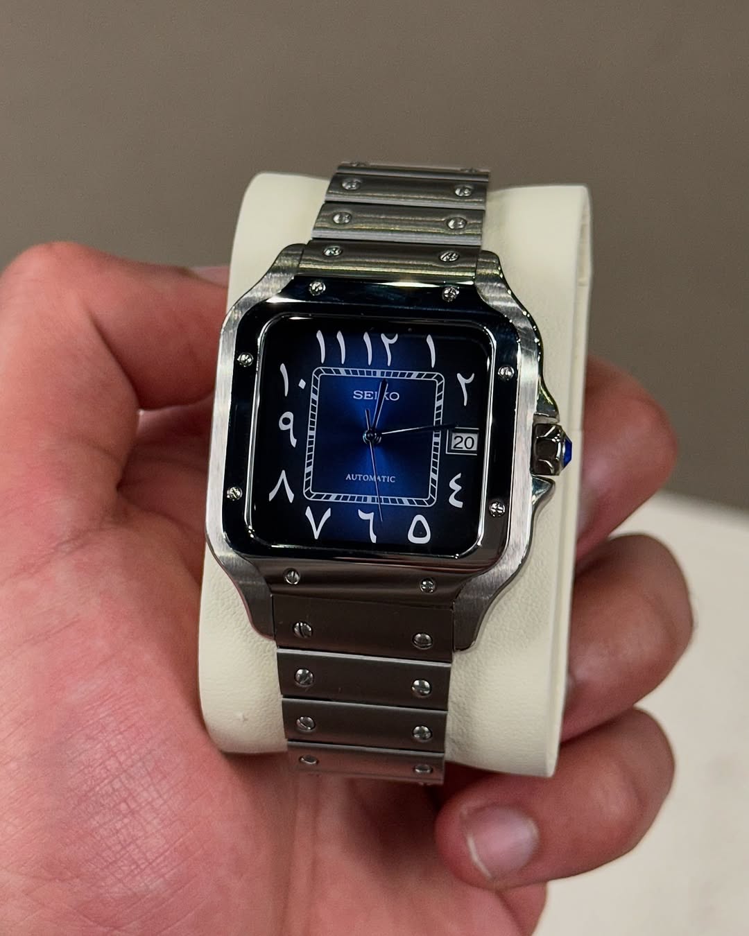 Blue Arabic Seiko mod watch close-up with case and dial details