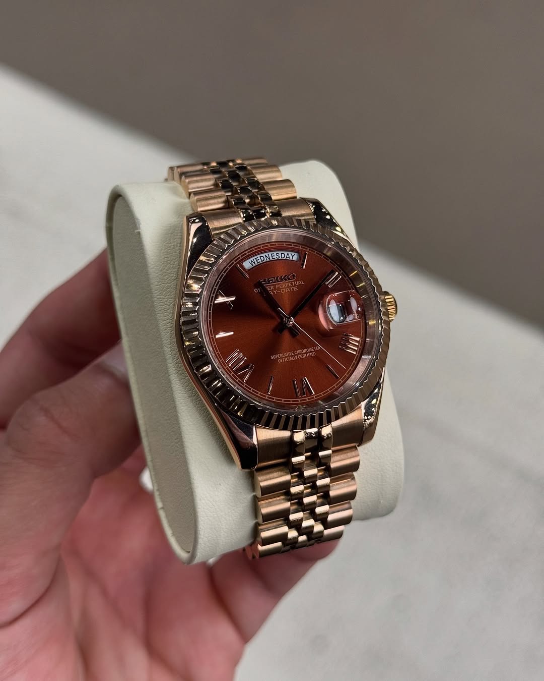 Chocolate Roman Seiko mod watch on wrist with luxury design