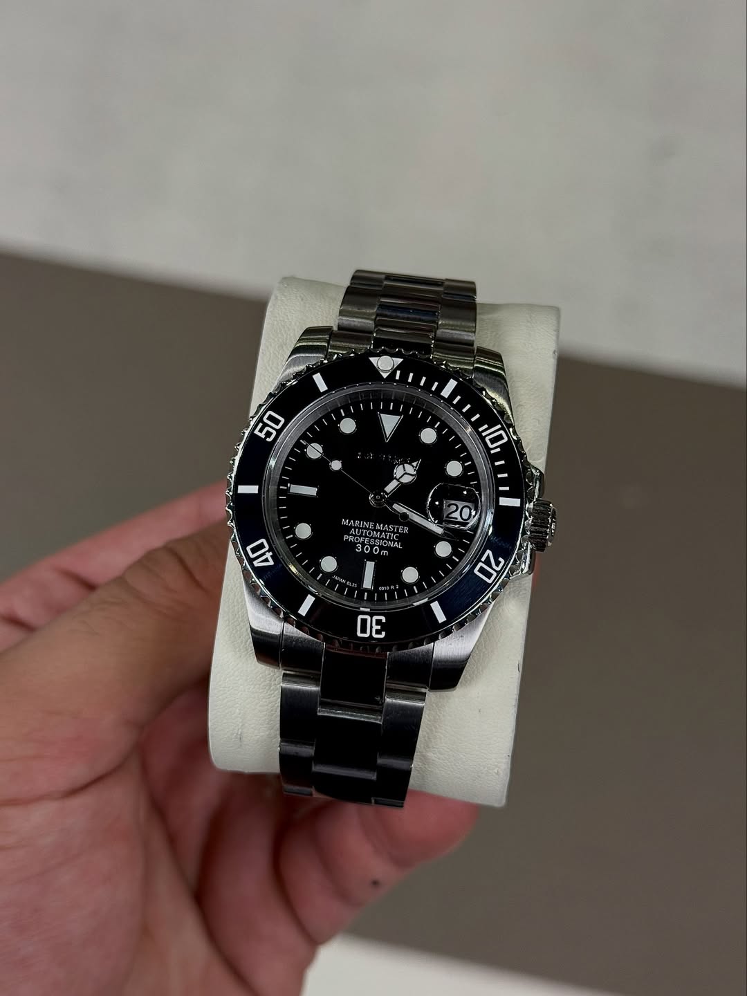 Dark Marine Gmt Seiko mod watch on wrist with luxury design