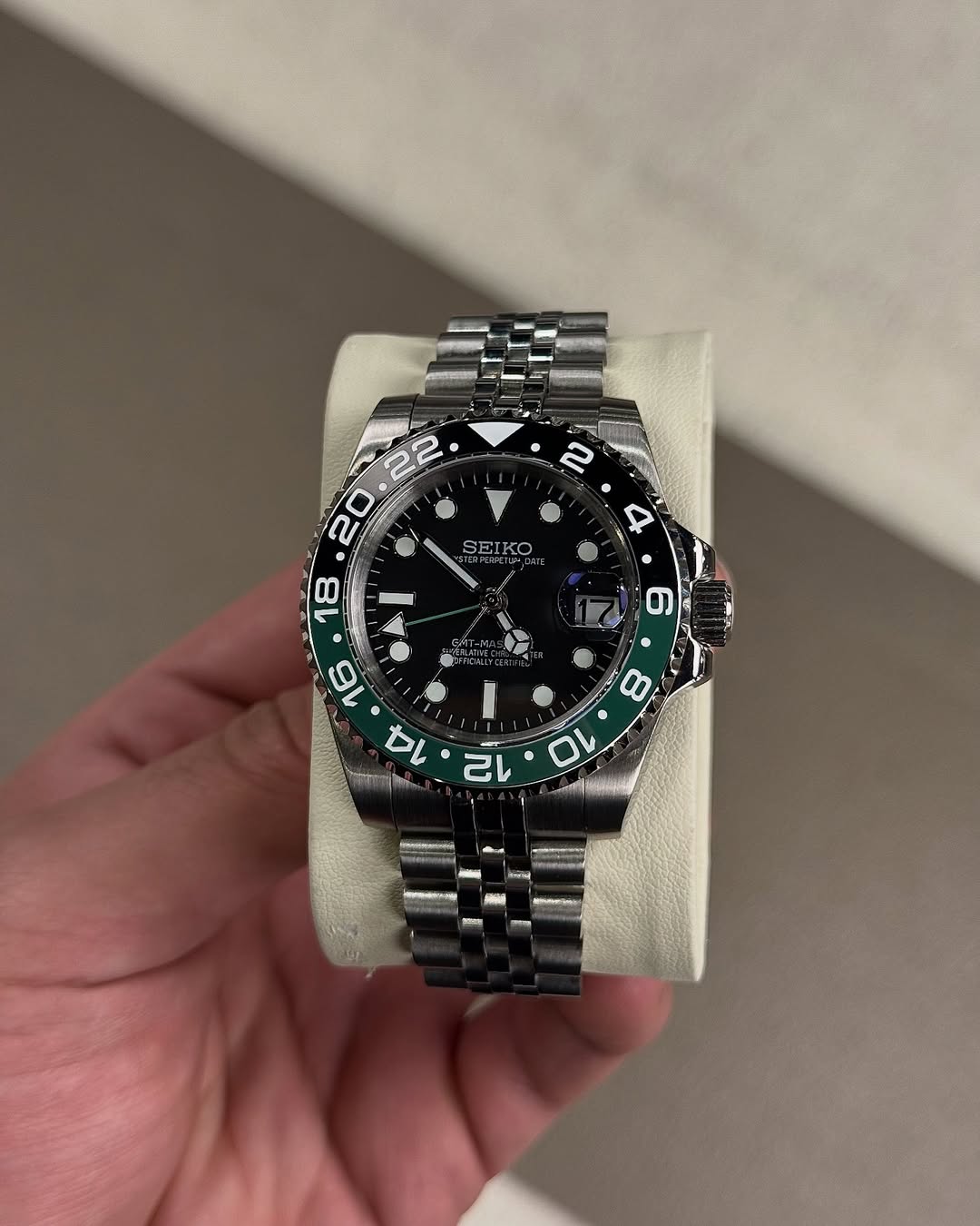 Lime Green Gmt Seiko mod watch on wrist with luxury design