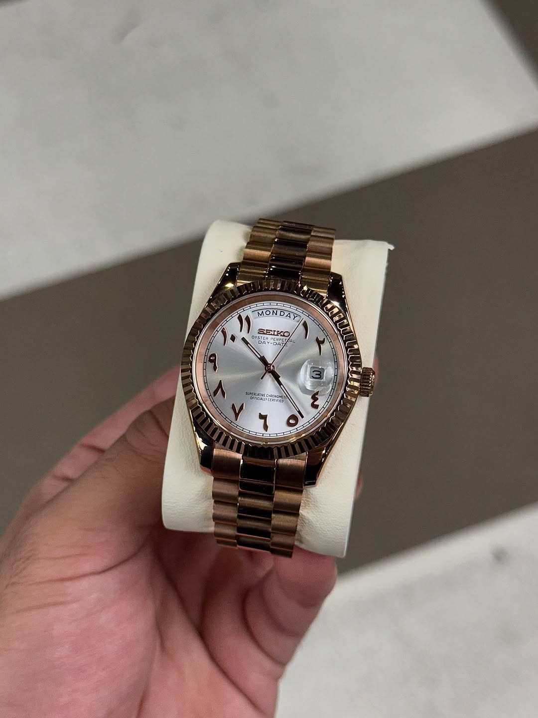Rose Aura Seiko mod watch on wrist with luxury design