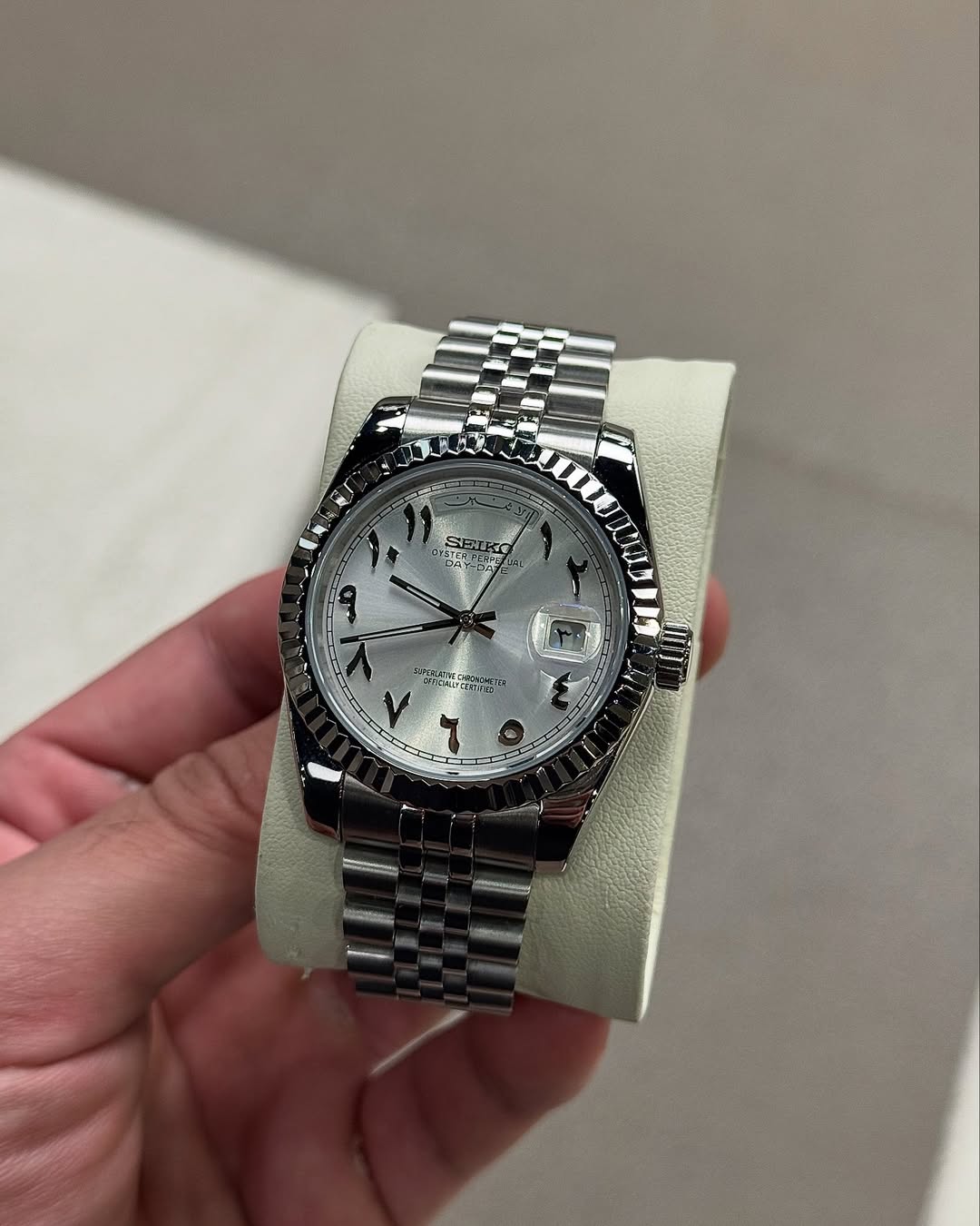 Platinum Arabic Seiko mod watch on wrist with luxury design