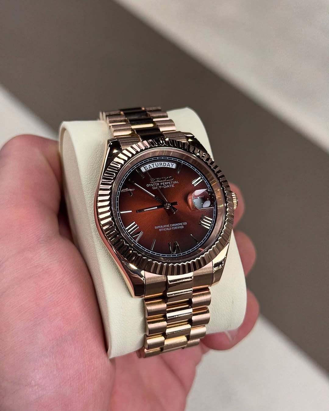 Champagne Gold Roman Seiko mod watch on wrist with luxury design